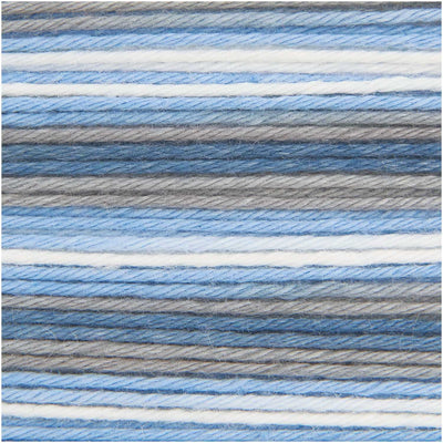 A 50g ball of Rico Baby Cotton Soft Print DK featuring a soft variegated mix of  teal and sky blue