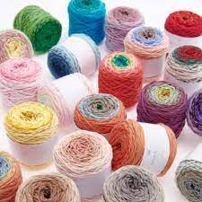 A variety of colorful spin spin yarn cakes in different colors intended for crafting. Self-striping cotton yarn, summer wearables yarn, 50g cotton cake, colorful amigurumi supplies, breathable knitting yarn