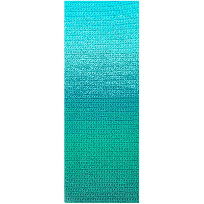 A vibrant cake of Ricorumi Spin Spin yarn showing a smooth crocheting transition from deep ocean blue to soft seafoam green.