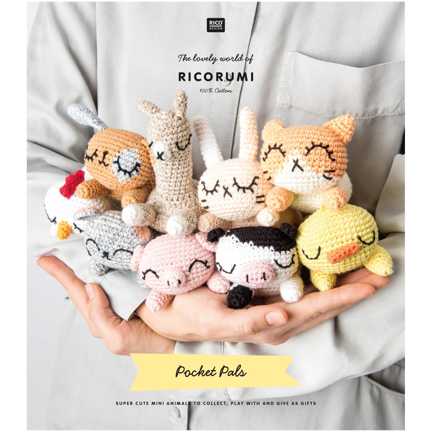 Ricorumi Pocket Pal instruction book with easy-to-follow patterns for pocket-sized crochet toys; an ideal gift for amigurumi beginners. A group shot of the 9 finished Pocket Pals, including the llama, cow, and cat, arranged on a desk as cute companions