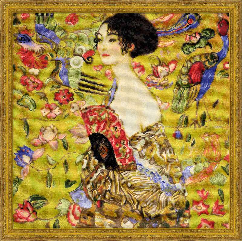 Riolis Lady with a Fan Counted Cross Stitch Kit after Gustav Klimt. Premium art-inspired embroidery set on 14ct black Aida with specialty wool-blend threads for a painterly finish. 
'Lady with a Fan,' featuring a woman in a richly patterned robe against a golden yellow background with floral and bird motifs."