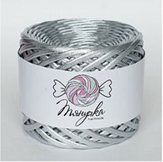 A roll of Tyanuchka Metallic Yarn in a shimmering silver finish, showing its flat, ribbon-like structure and high-gloss texture in silver colour