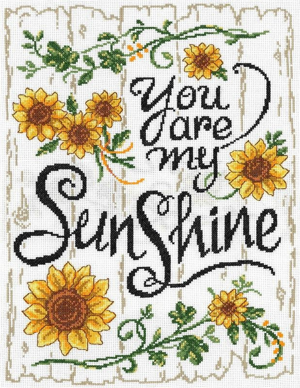 Cross stitch kit depicting a white aida fabric with yellow sunflower designs and the text 'You are my Sunshine' along with floral elements.
