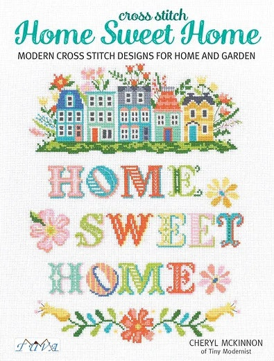 The "Home Sweet Home" cross stitch pattern book by TUVA, featuring a collection of modern and traditional home-themed embroidery charts for cushions, wall art, and table linens.