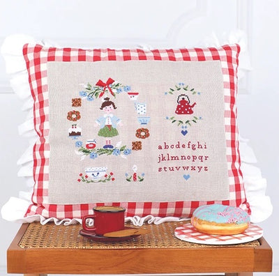 The TUVA My Home embroidery book, highlighting the clean, minimalist layout and beautiful lifestyle photography that inspires seasonal home decorating through needlework.