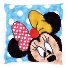 Cross-stitched design of a cartoon character with a blue background