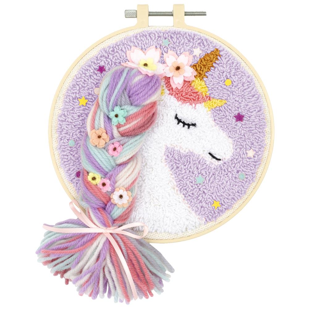 A finished Needle Creations Unicorn punch needle piece, showing the thick, loopy 3D texture and vibrant colorful mane.