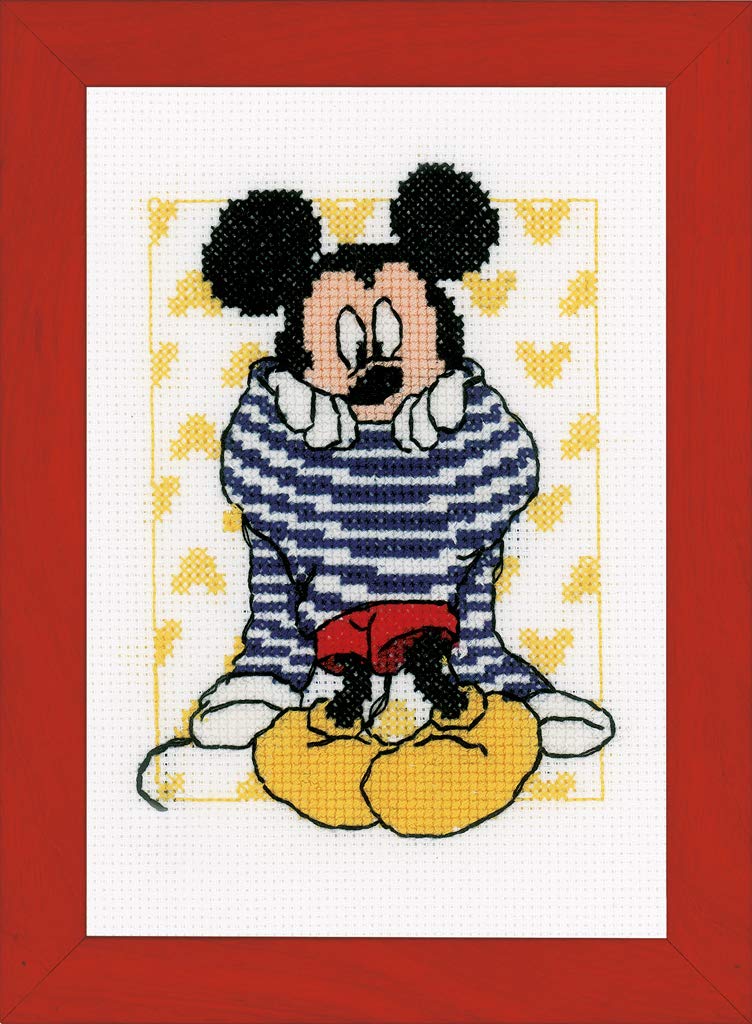 Cross-stitched design of a character in a red frame