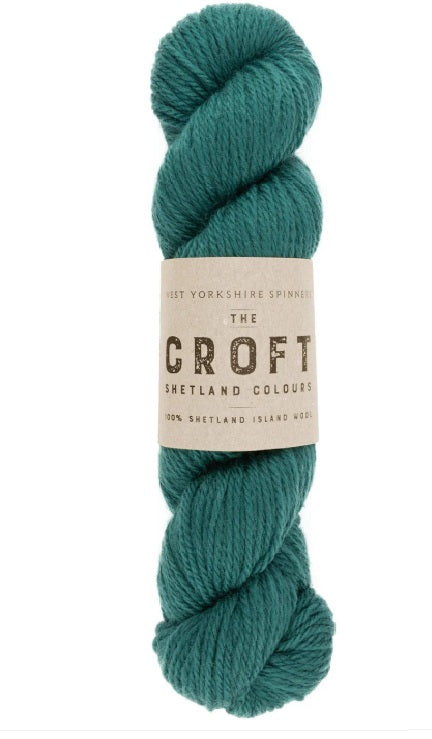 Close-up of WYS The Croft Aran wool in Seafield, showing the unique multi-tonal flecks and soft, sturdy handle of authentic Shetland fiber