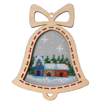 Cross-stitched bell ornament with a snowy village design. Festive gift giving ideas. Cross stitch hobbyist. ply wood frame included.