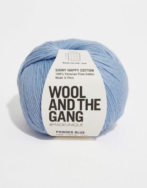 A 100g ball of Wool and the Gang Shiny Happy Cotton yarn in a vibrant powder blue shade, showing its smooth texture and subtle natural sheen