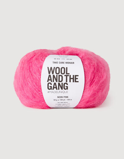 A voluminous 50g ball of Wool and the Gang Take Care Mohair, showing its iconic fluffy halo and soft, radiant fiber texture in neon pink colour