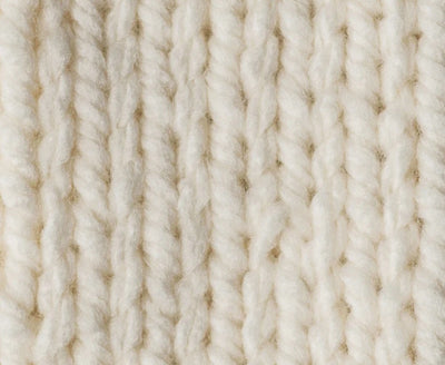 Close-up of beige yarn texture Close-up of the plush, super bulky plies of Bernat Softee Chunky, highlighting the smooth stitch definition and lack of fuzz in natural colour knitting yarn