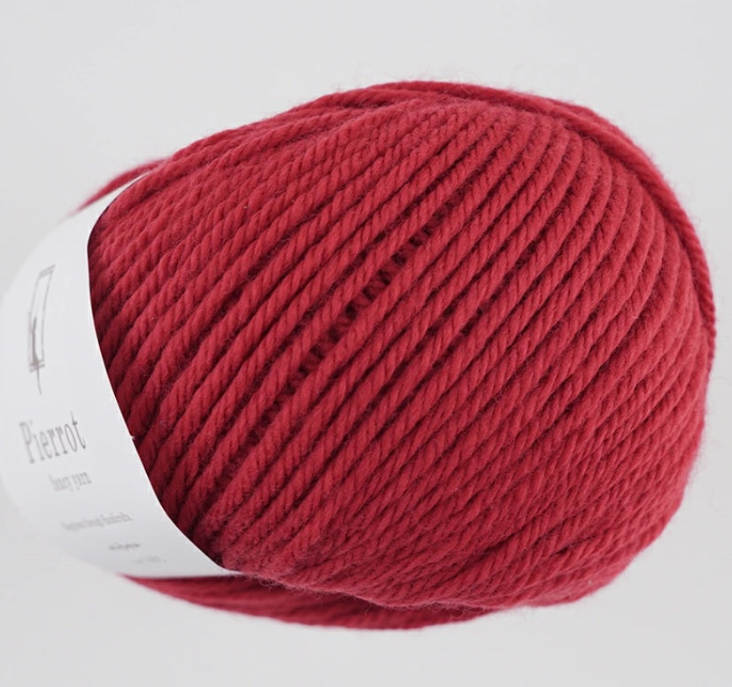 made in Japan yarn fine merino A skein of ultra-soft Pierrot Fine Merino wool yarn in a vibrant solid color, highlighting the smooth Japanese spinning technique in cheery red colour