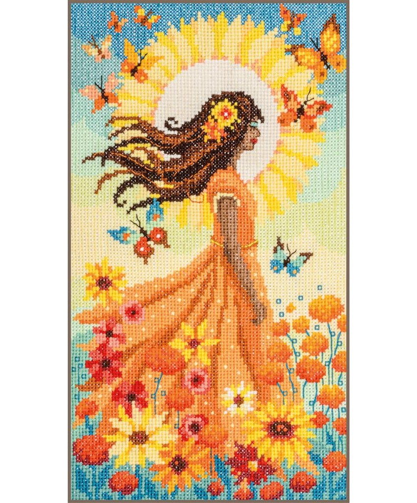 Cross-stitch pattern of a woman with flowing hair and orange dress surrounded by flowers and butterflies.