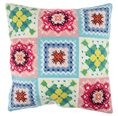 Beginner friendly, Cross Stitch kit. Colorful patchwork pillow with floral and geometric patterns on a white background
