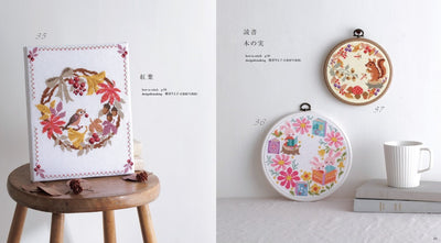 An open page showing a variety of autumn-themed motifs including falling leaves, acorns, and cozy woodland creatures. Featuring autumn wreath, squirrels and mushrooms.