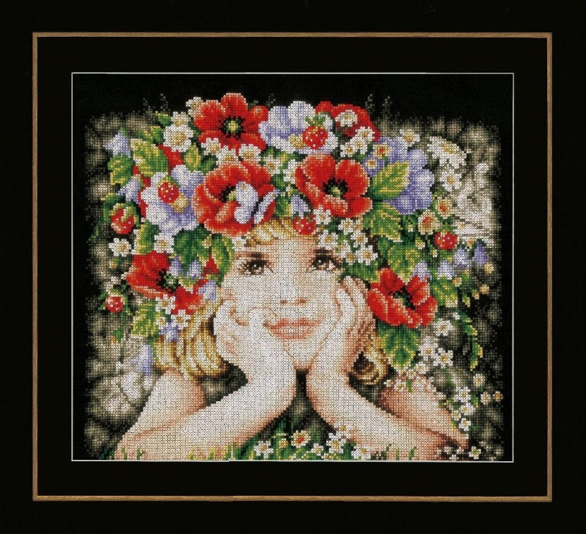 Cross-stitched design of a girl with a floral wreath on her head on a black aida cloth filled with vibrant colours