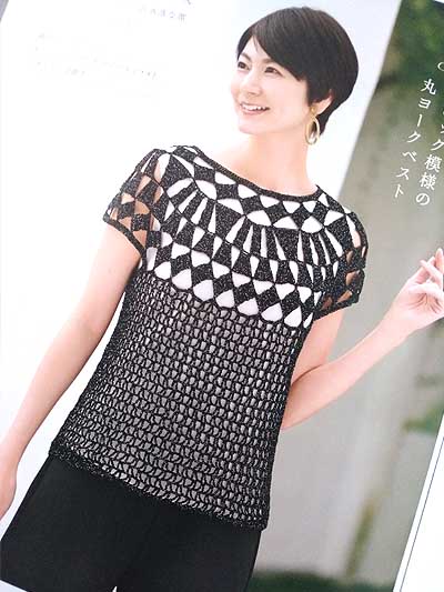 An open book showing a detailed Japanese crochet symbol chart alongside a high-quality photograph of a lightweight, cream-colored lace summer tunic. The page is clean and professional, emphasizing the intricate stitch work and the visual clarity of the instructional diagrams.