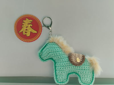 Hand crocheted in Singapore artisan Crochet horse-shaped keychain. Small craft shop hand made item for sale.