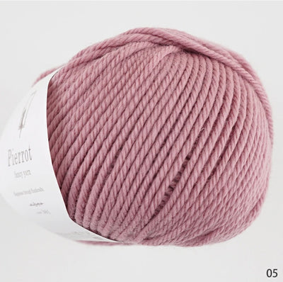 made in Japan yarn fine merino A skein of ultra-soft Pierrot Fine Merino wool yarn in a vibrant solid color, highlighting the smooth Japanese spinning technique in Sakura Pink colour