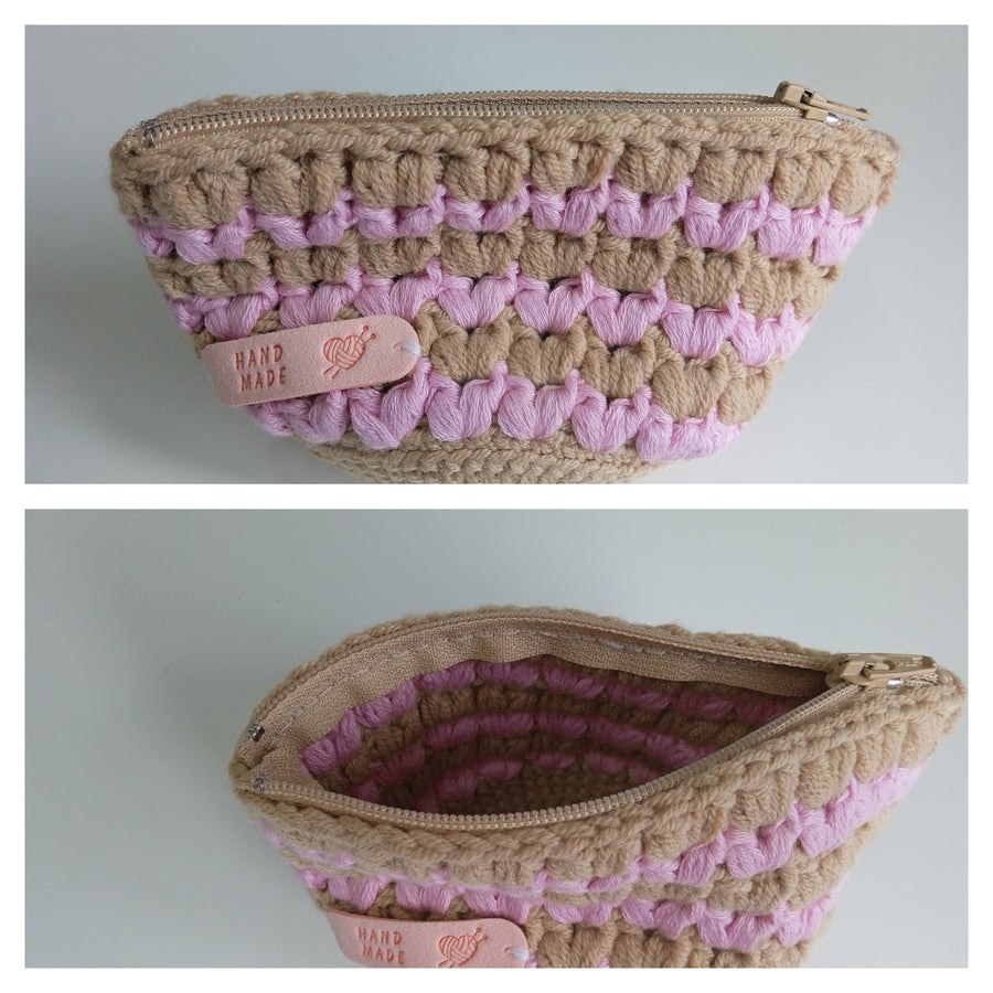 Two views of a handcrafted pouch with pink and brown striped pattern on a light gray background. Crocheted zipped pouch for sale