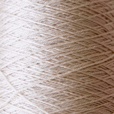 he iridescent effect of Pierrot Silk100 yarn, showing how the color changes from deep jewel tones to bright highlights under different lighting.
