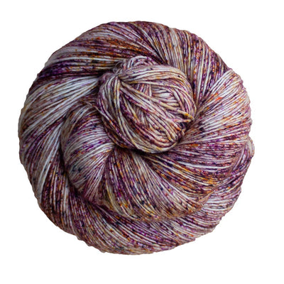 100% Superwash Merino Wool Hand Dyed Yarn on specks of pink and purple