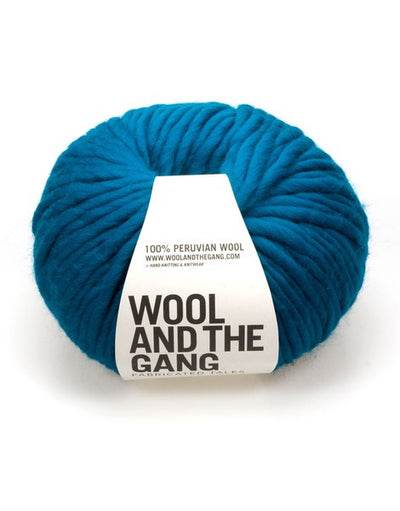 A bold red ball of Wool and the Gang Crazy Sexy Wool yarn with a label in the center against a white in background Sherpa Blue colour.