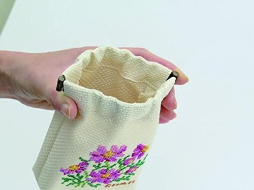 An Olympus Cosmo cross stitch kit for a floral-themed snap pouch. The image shows the soft, 100% cotton fabric with a pre-marked grid, a palette of vibrant Cosmo embroidery threads, a metal snap-top frame, and a clear symbol-based pattern chart, all made in Japan