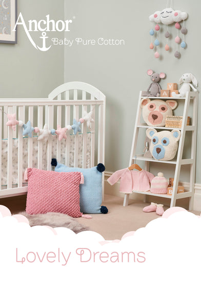 A book titled 'Lovely Dreams' by Anchor, displaying a pattern chart for knitting or crochet a baby-themed item, with visual references to completed product examples.