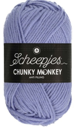 A lush, oversized ball of Scheepjes Chunky Monkey Aran yarn in a vibrant solid color, featuring a thick, smooth twist and a subtle silky sheen in mauve purple colour.