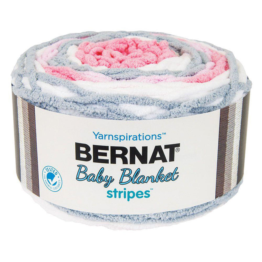 A ball of Bernat Baby Blanket Stripes yarn in pink, gray, and white colors.