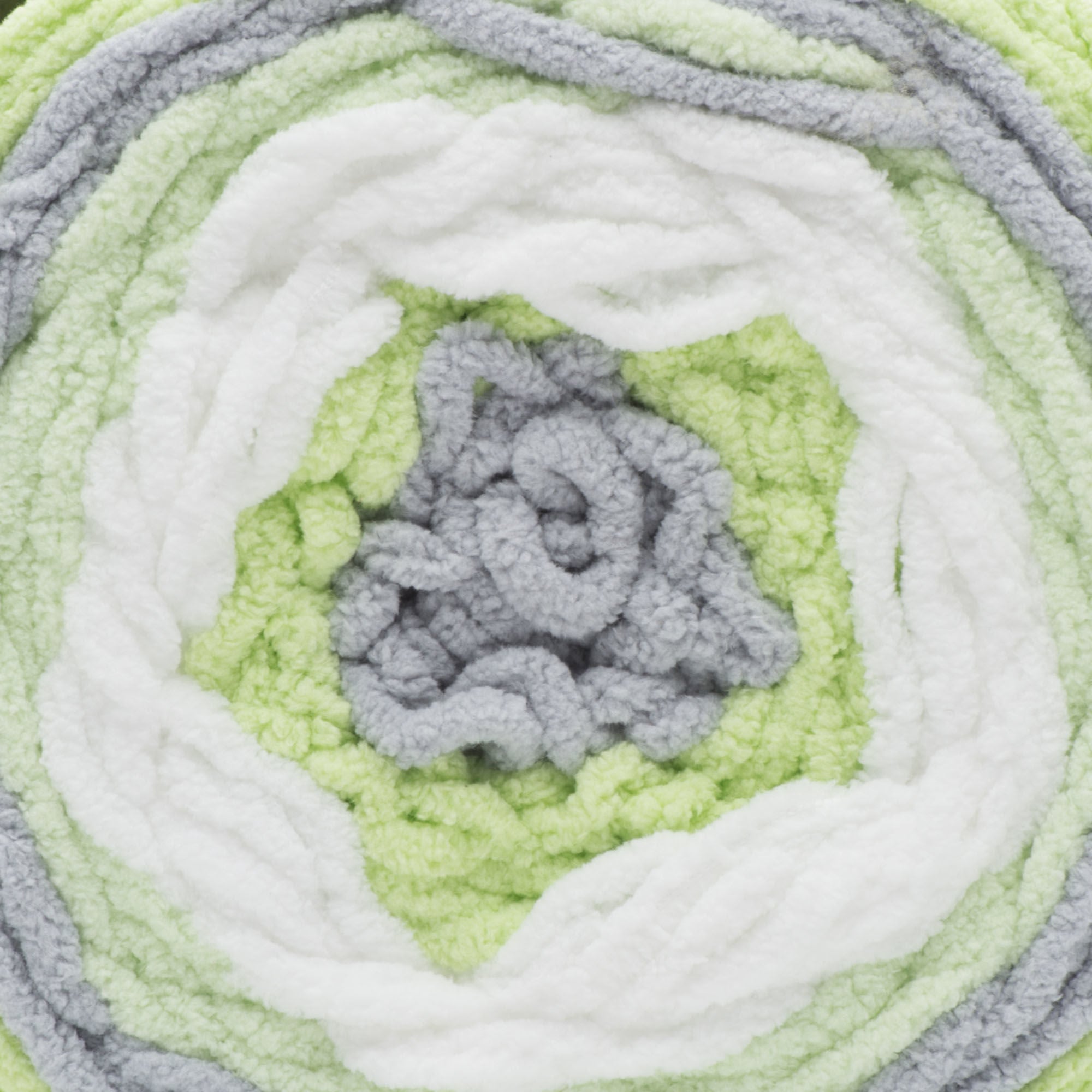 A ball of Bernat Baby Blanket Stripes yarn in green, gray, and white colors.