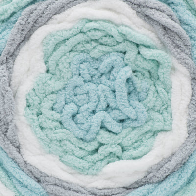 A ball of Bernat Baby Blanket Stripes yarn in mint green, gray, and white colors.