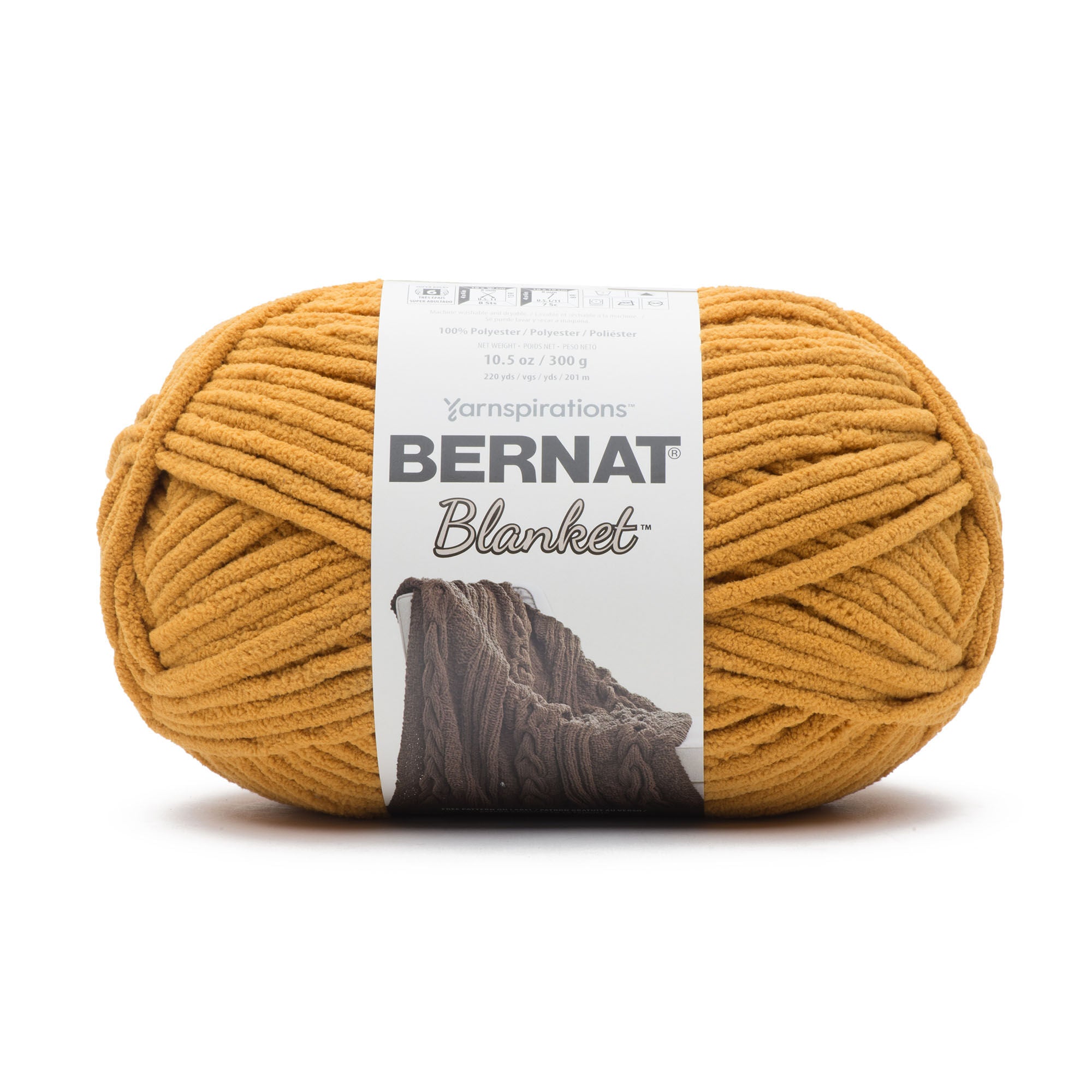 Close-up of Bernat Blanket yarn showing the plush velvety texture; a hypoallergenic and machine-washable yarn ideal for baby blankets and home decor in Nurnt Mustard Colour