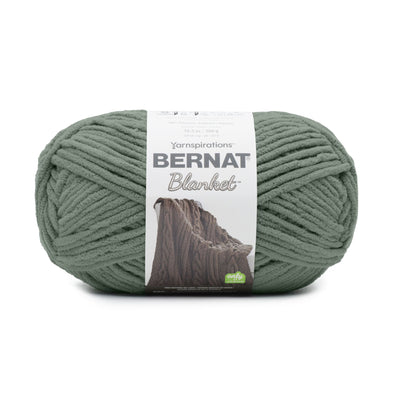 Close-up of Bernat Blanket yarn showing the plush velvety texture; a hypoallergenic and machine-washable yarn ideal for baby blankets and home decor. Smokey green colour