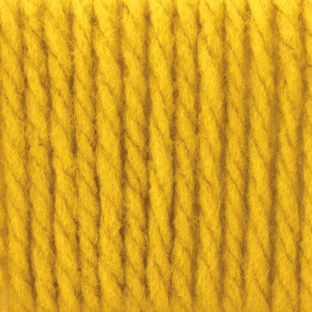 A skein of Bernat Softee Chunky yarn in glowing yellow gold colour
