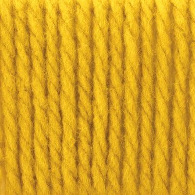 A skein of Bernat Softee Chunky yarn in glowing yellow gold colour