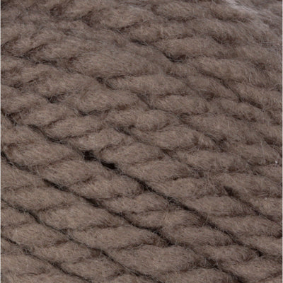 A 100g skein of Bernat Softee Chunky yarn in a vibrant solid color, showing its thick, plied structure and soft matte finish in Taupe Grey Colour