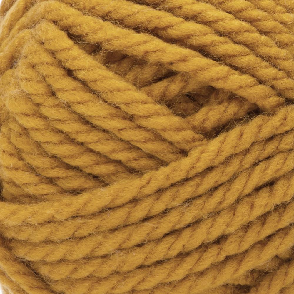 A skein of Bernat Softee Chunky yarn in brass color. A 100g skein of Bernat Softee Chunky yarn in a vibrant solid color, showing its thick, plied structure and soft matte finish.
