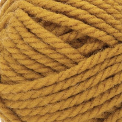 A skein of Bernat Softee Chunky yarn in brass color. A 100g skein of Bernat Softee Chunky yarn in a vibrant solid color, showing its thick, plied structure and soft matte finish.