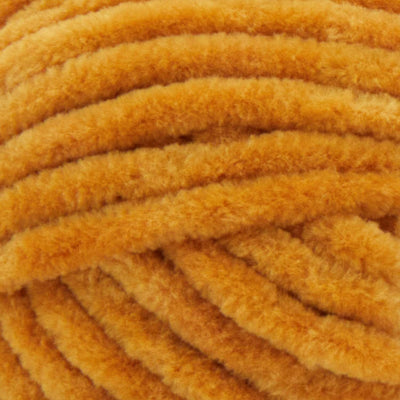 A soft, bulky weight Premier Parfait Chunky yarn perfect for making amigurumi and plush home decor in mustard brown