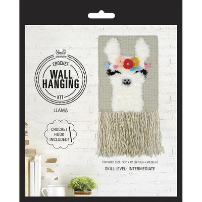 A 9.5x19 inch llama crochet wall hanging displayed in a modern boho-style nursery, adding color and texture to the room.