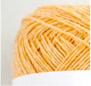 Close-up of Pont du Gard linen thread, highlighting the crisp, uniform spin and the natural strength of the 100% French flax in orange colour
