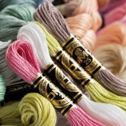 DMC color codes, 6-strand cotton floss, embroidery thread bundle, colorfast cross stitch supplies, professional needlework thread
Close-up of a single DMC thread skein label, showing the iconic horsehead logo and the specific color code number for easy identification
