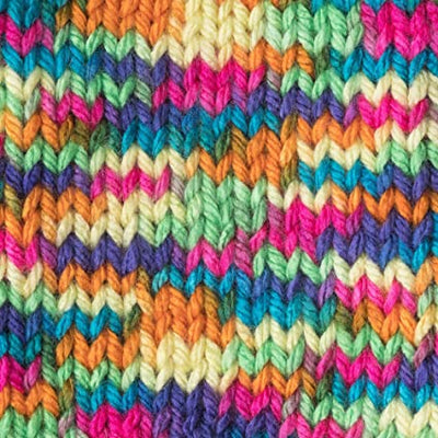 Close-up of Caron Simply Soft Paints showing the dimensional color transitions and lustrous finish; perfect for machine-washable blankets and fashion accessories