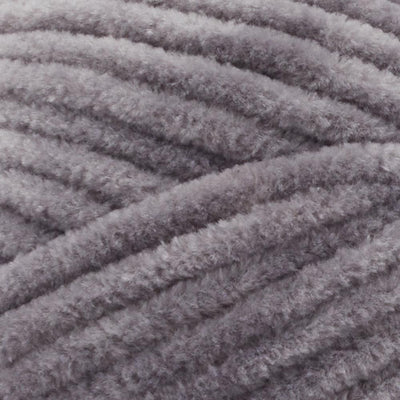 Close-up of Premier Parfait Chunky polyester yarn, highlighting the dense, plush pile and vibrant color in seal grey colour