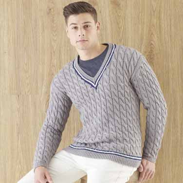 A finished knitted piece from the booklet styled with casual chinos, illustrating the 'effortlessly stylish' weekend look of the collection.