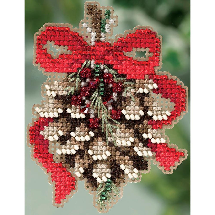 Mill Hill Pinecone beaded cross stitch kit packaging showing the finished pinecone design with shimmering brown and gold glass beads.